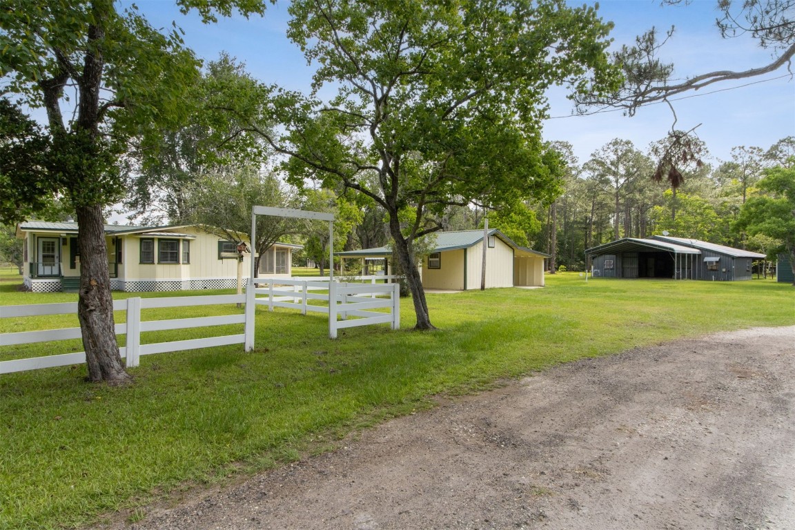 2889 Santa Fe Trail Hilliard, FL 32046 - Photo 8 of 49 a view of house in front of a big yard with large trees