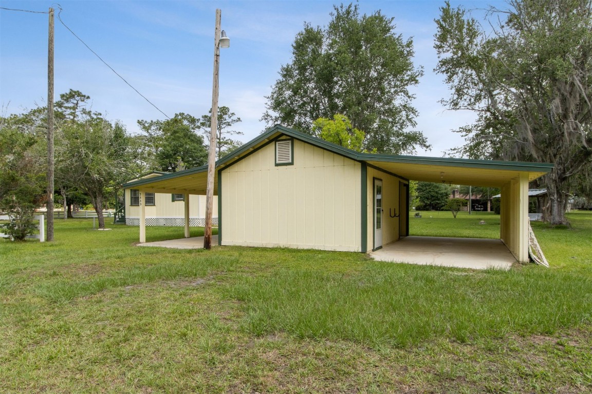 2889 Santa Fe Trail Hilliard, FL 32046 - Photo 9 of 49 a view of a house with a yard