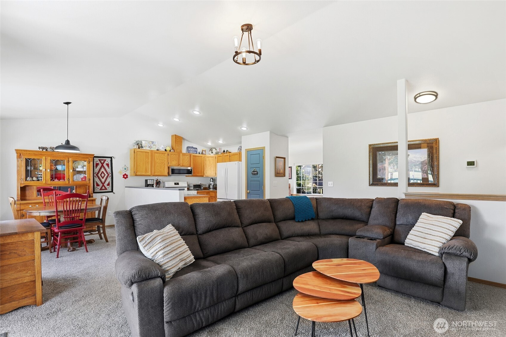 8008 188th Avenue Southwest Rochester, WA 98579 - Photo 10 of 40 a living room with furniture a rug and a chandelier