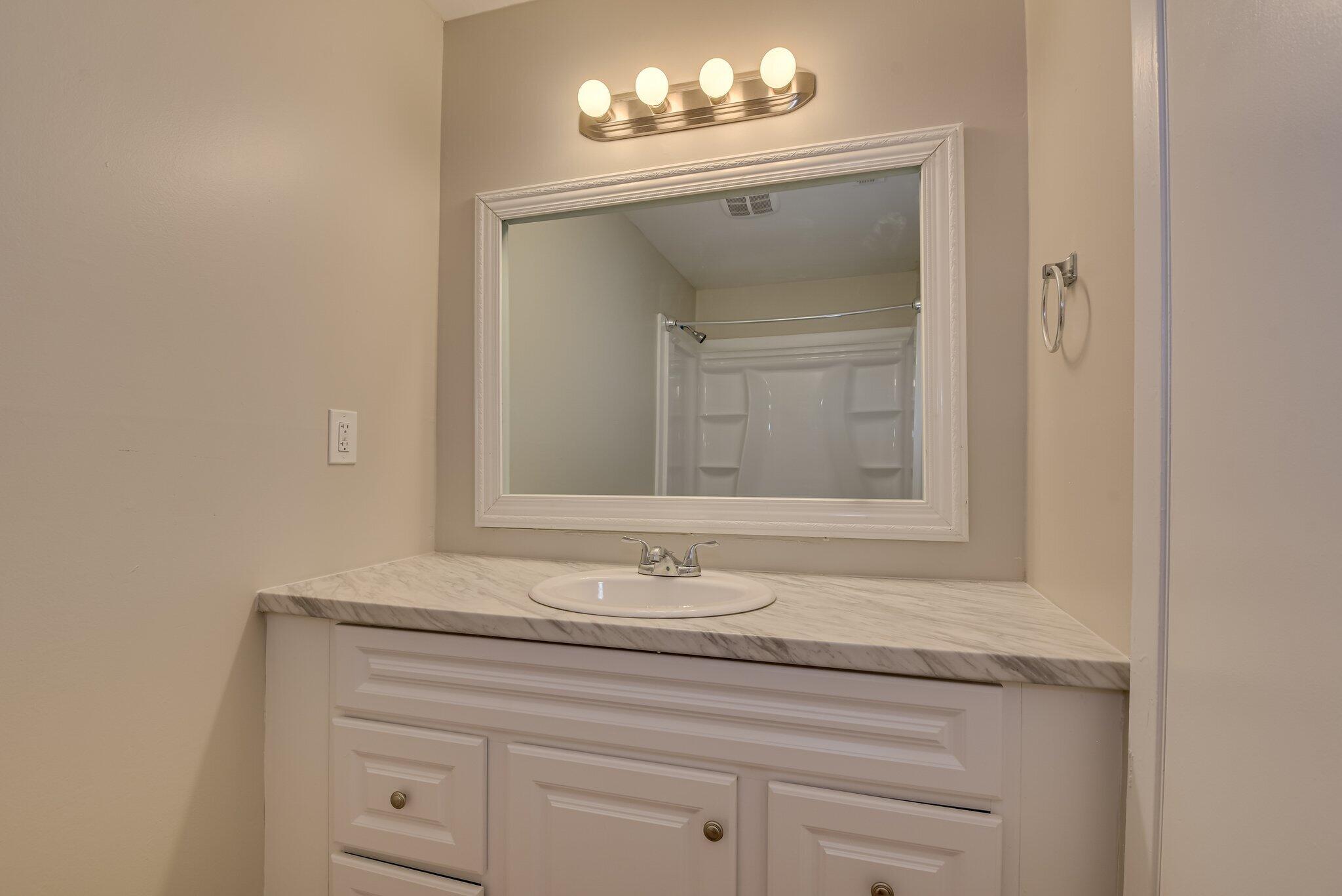 2115 Ashley Drive Augusta, GA 30906 - Photo 29 of 38 a bathroom with a sink vanity and mirror