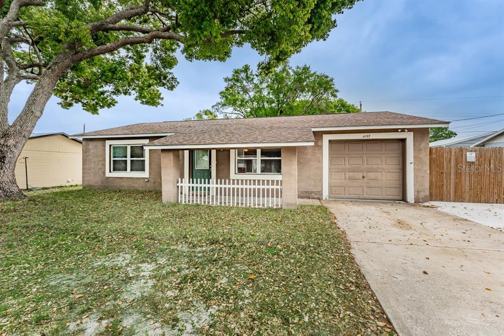 4157 Highland Loop New Port Richey, FL 34652 - Photo 1 of 1 front view of a house with a plants