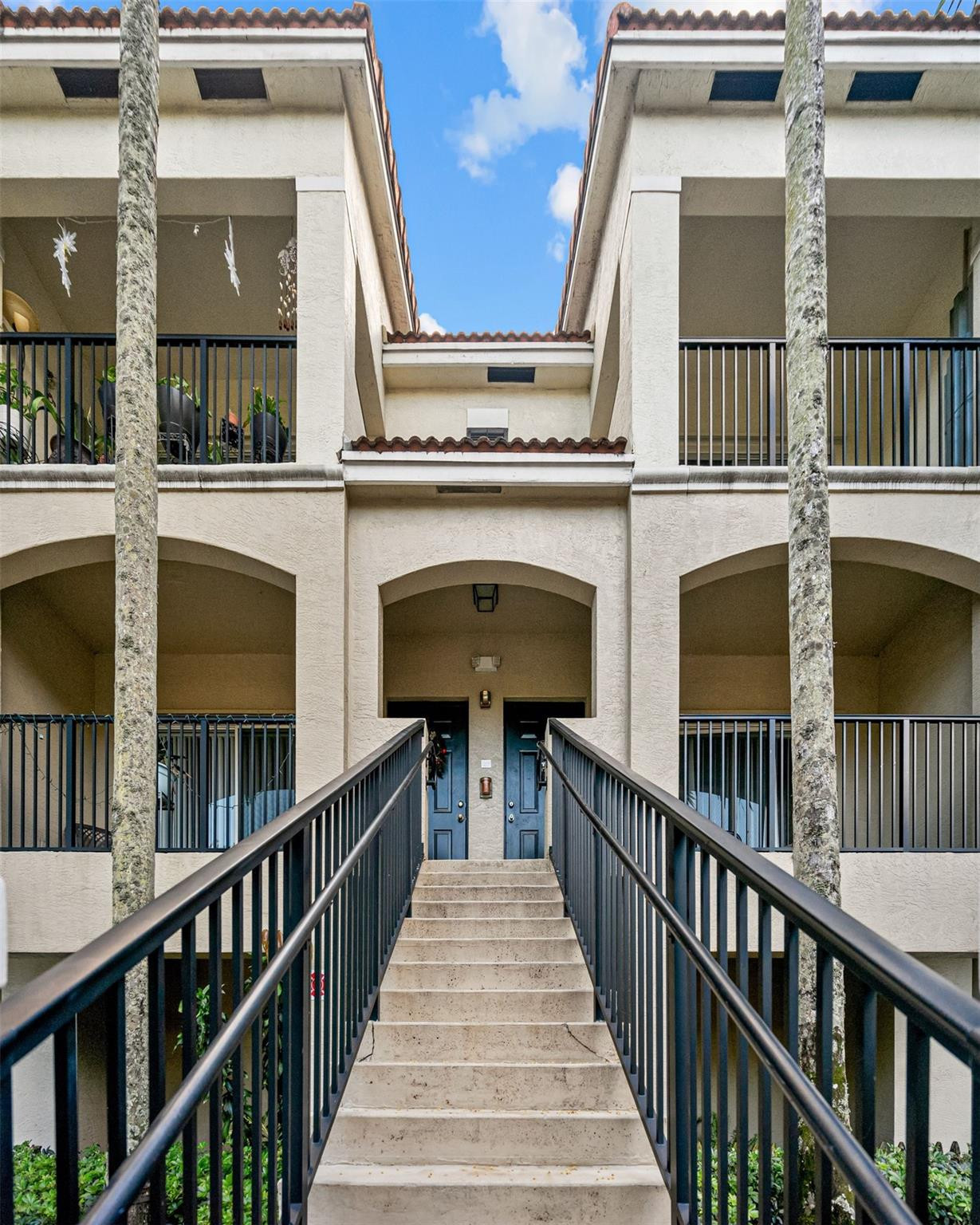 5880 West Sample Road, Unit 307 Coral Springs, FL 33067 - Photo 1 of 25 a view of a brick building with many windows