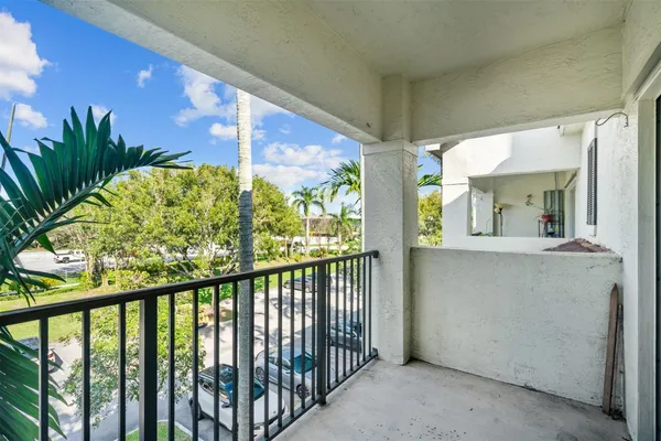 a view of balcony and yard