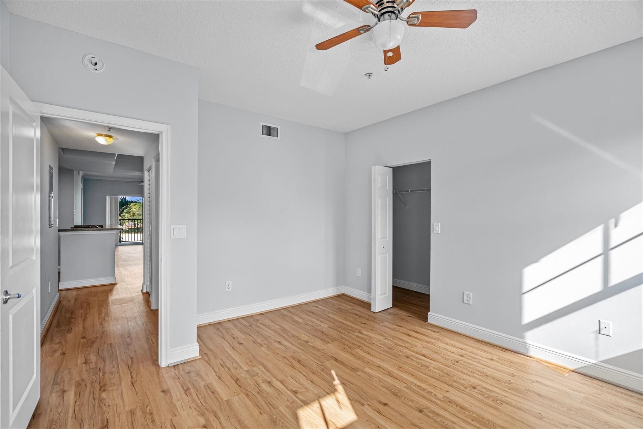 5880 West Sample Road, Unit 307 Coral Springs, FL 33067 - Photo 14 of 25 a view of empty room with wooden floor