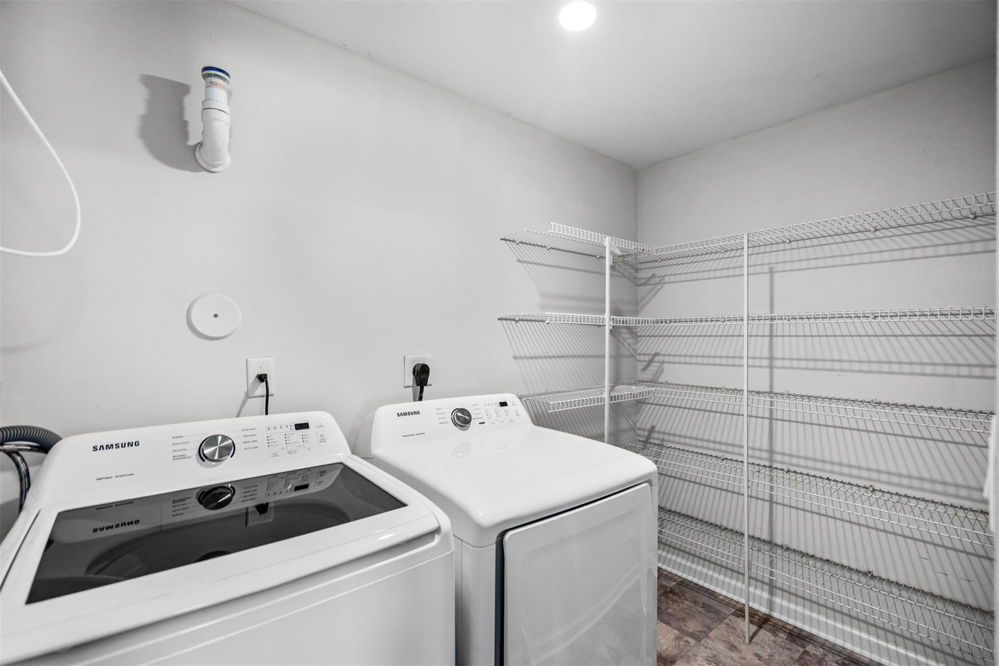 5880 West Sample Road, Unit 307 Coral Springs, FL 33067 - Photo 18 of 25 a utility room with dryer and washer