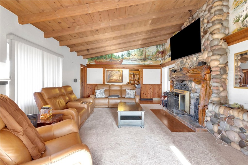 14415 Erie Road Apple Valley, CA 92307 - Photo 12 of 61 a living room with fireplace furniture and a flat screen tv