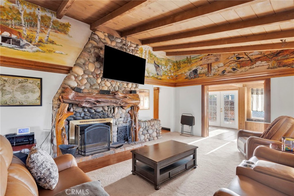 14415 Erie Road Apple Valley, CA 92307 - Photo 15 of 61 a living room with furniture a fireplace and a flat screen tv