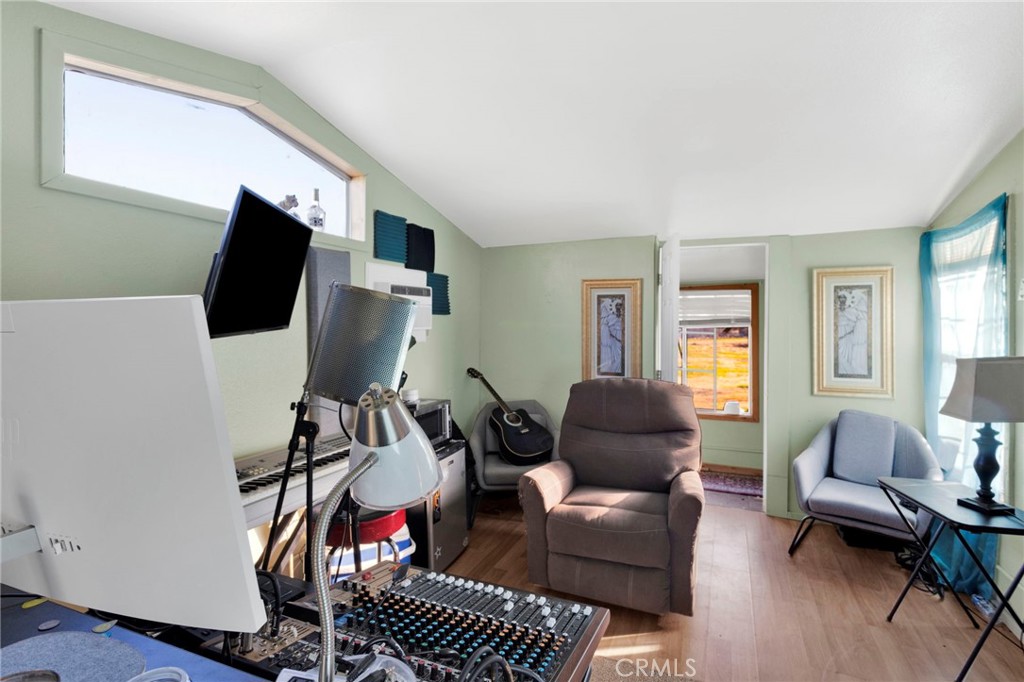 14415 Erie Road Apple Valley, CA 92307 - Photo 47 of 61 a living room with furniture and a flat screen tv