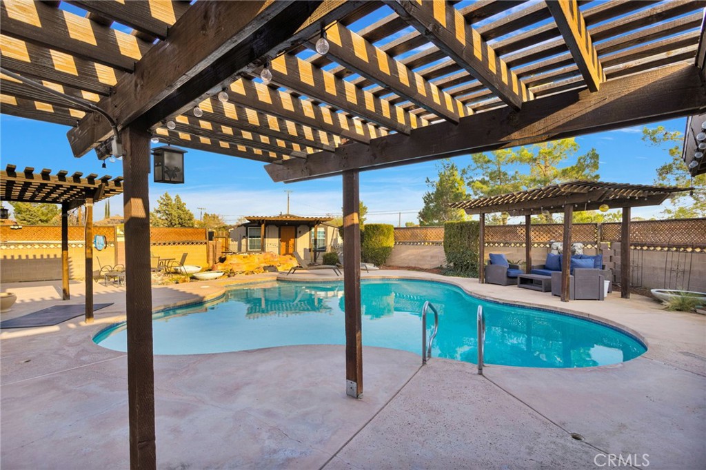 14415 Erie Road Apple Valley, CA 92307 - Photo 59 of 61 a view of a swimming pool with a porch