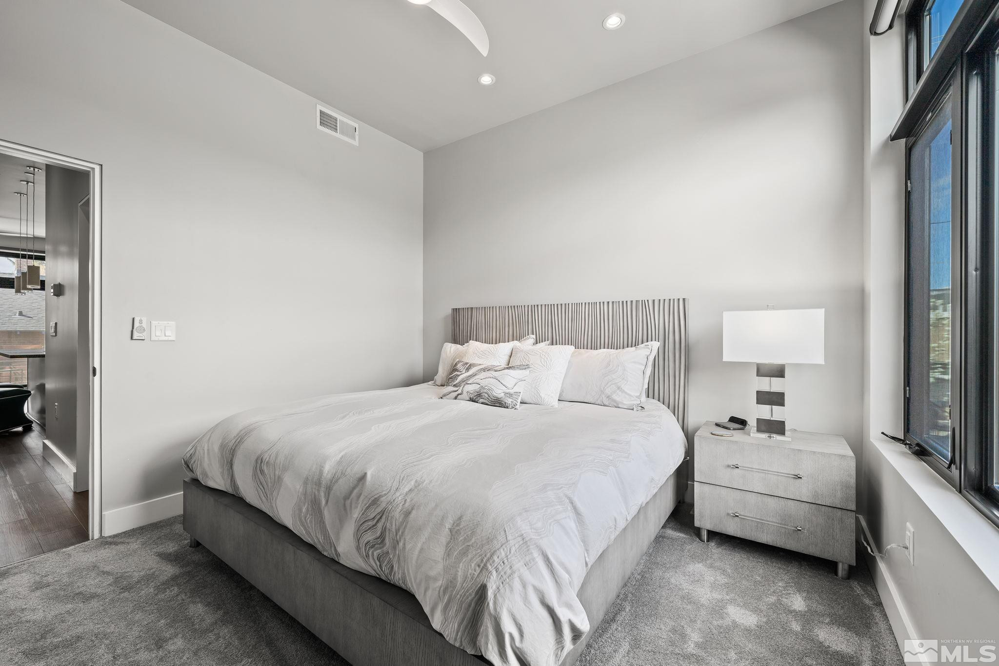 104 High Street Reno, NV 89502 - Photo 18 of 28 a bedroom with a bed and a large window