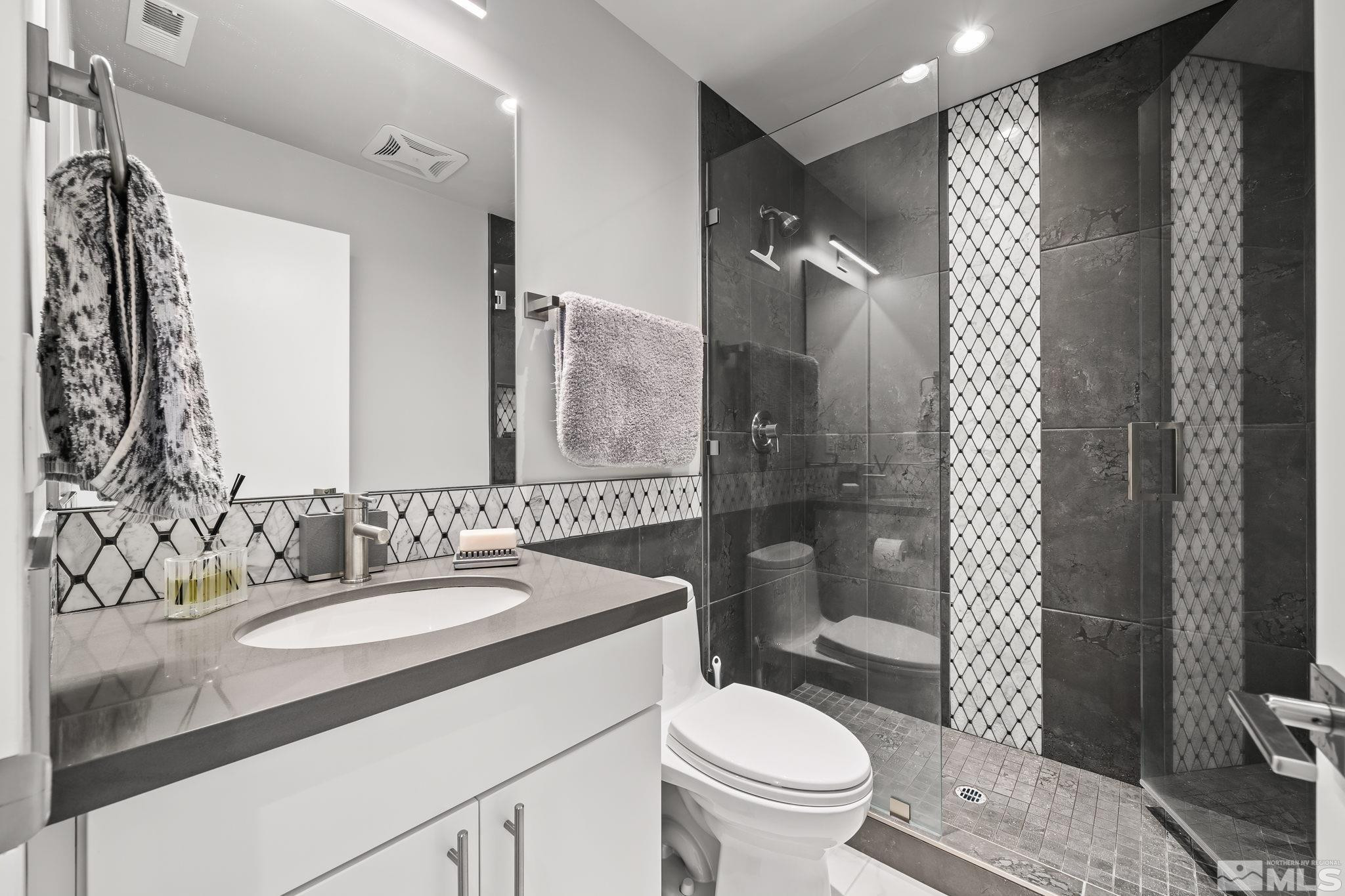 104 High Street Reno, NV 89502 - Photo 20 of 28 a bathroom with a sink toilet and shower