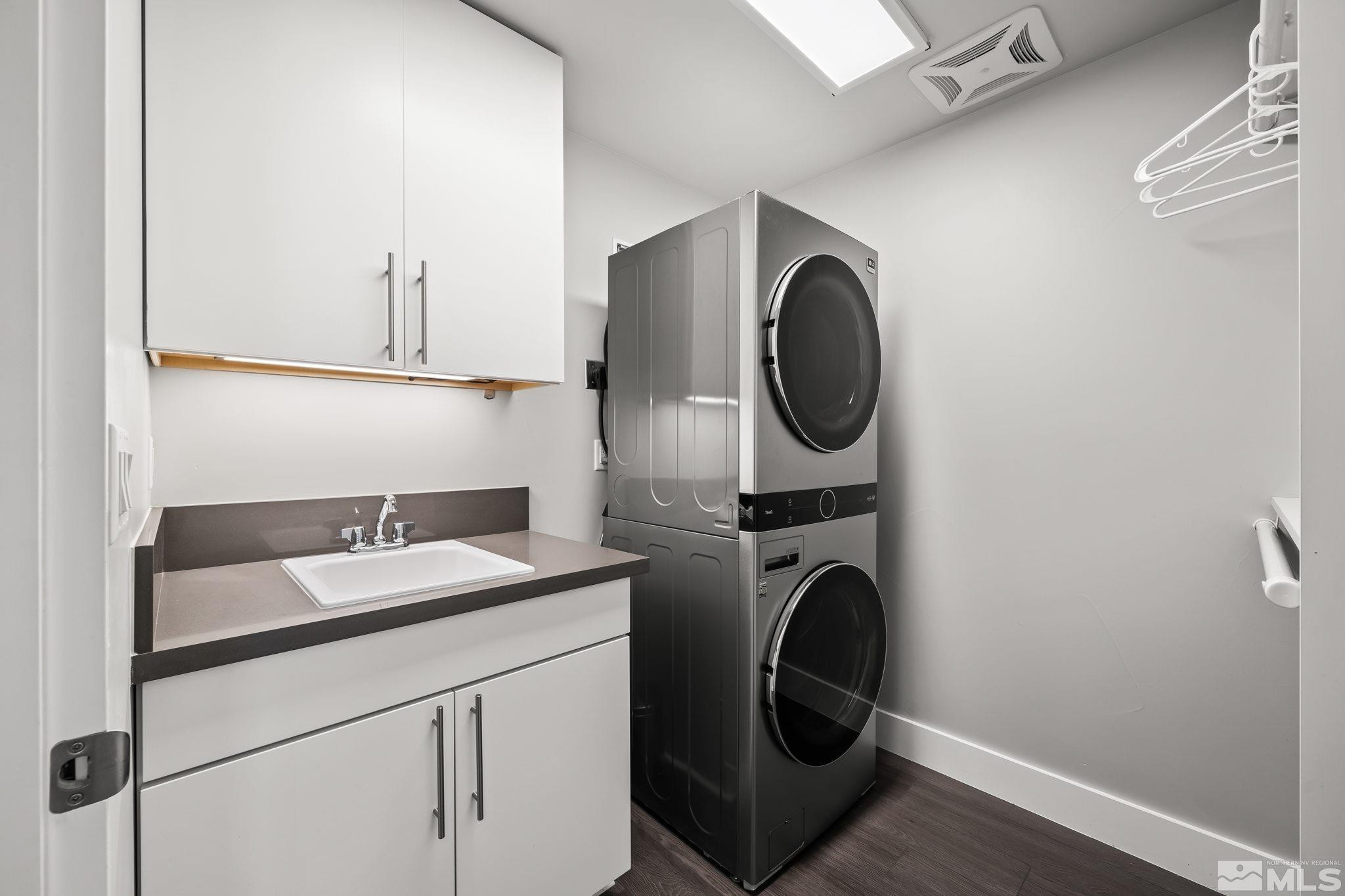 104 High Street Reno, NV 89502 - Photo 22 of 28 a bathroom with a sink and a washer dryer