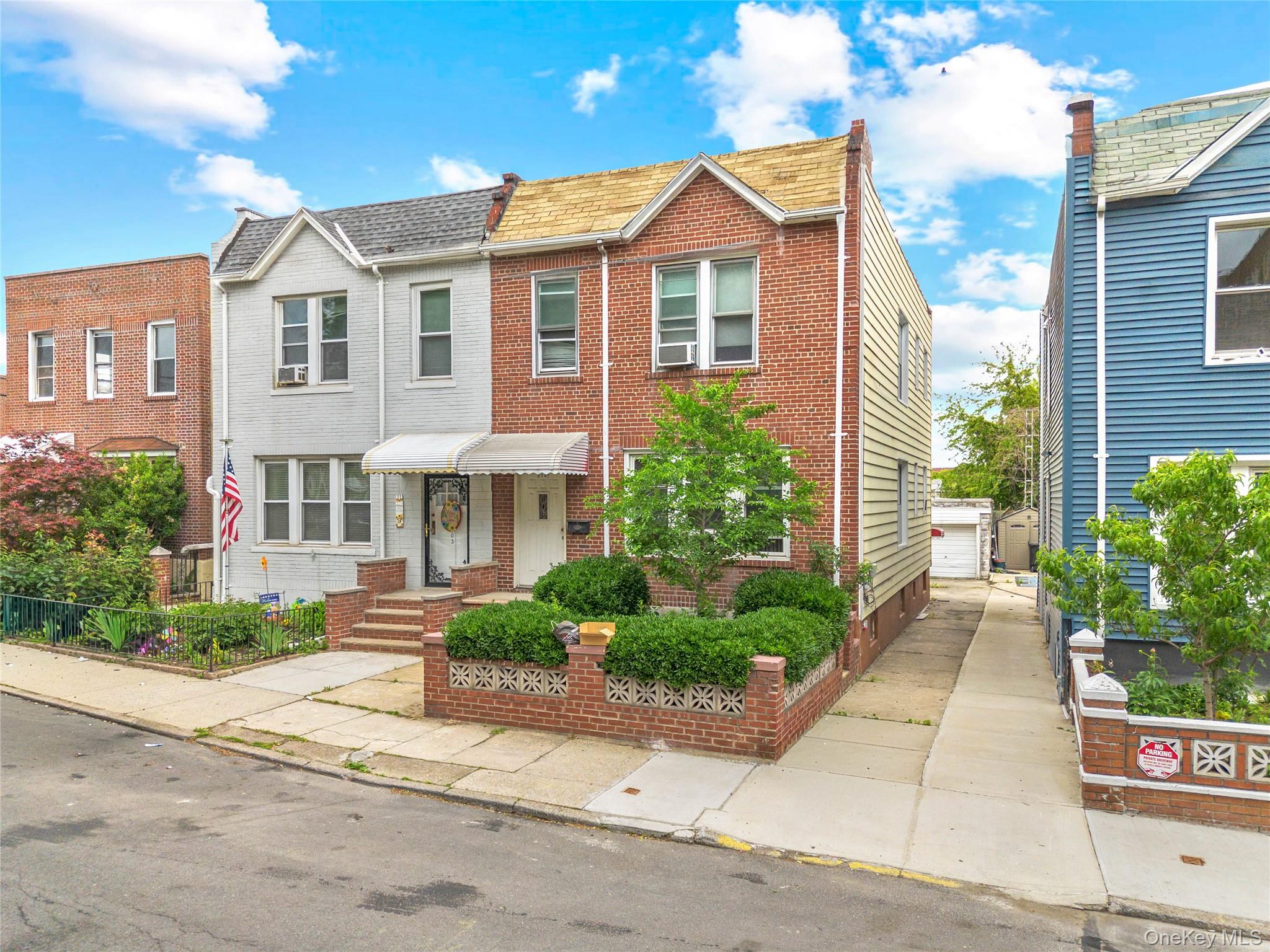 37-07 20th Road Queens, NY 11105 - Photo 5 of 24 a view of a brick house with a yard and plants