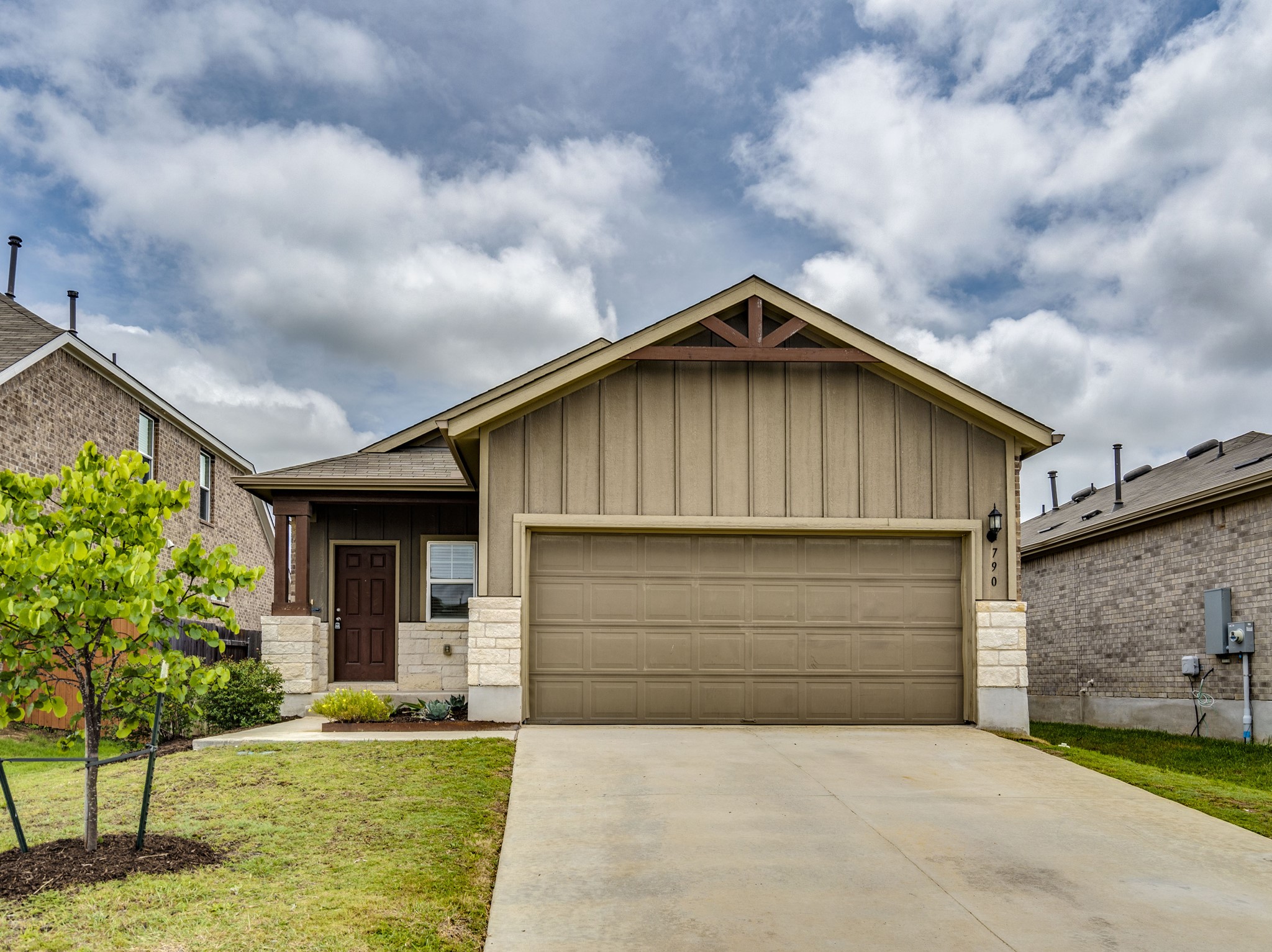 790 Pepperbark Loop Buda, TX 78610 - Photo 2 of 22 A well-kept front yard and inviting porch define the appealing approach to this single-story residence.