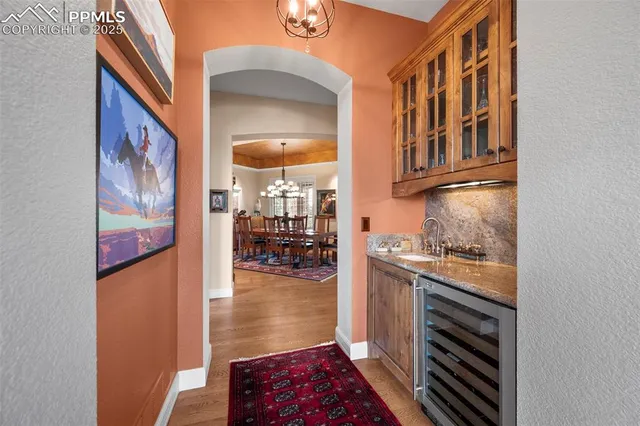 a dining room with furniture window and wooden floor