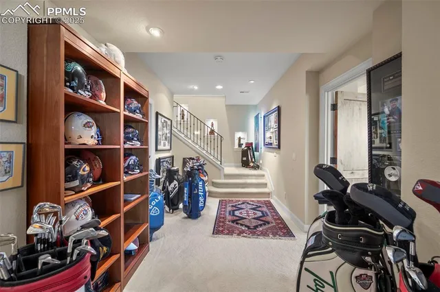 a living room with furniture fireplace and a large window