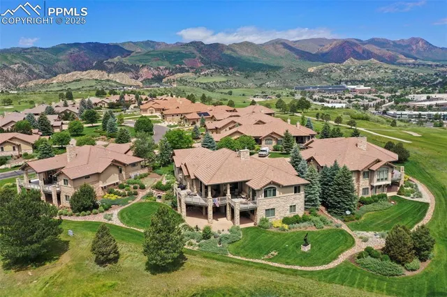 a view of a house with backyard porch and sitting area