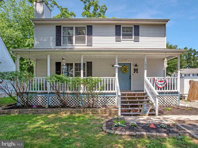 a front view of a house with a fence