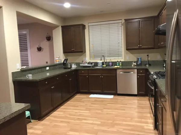 a kitchen with a sink and wooden cabinets