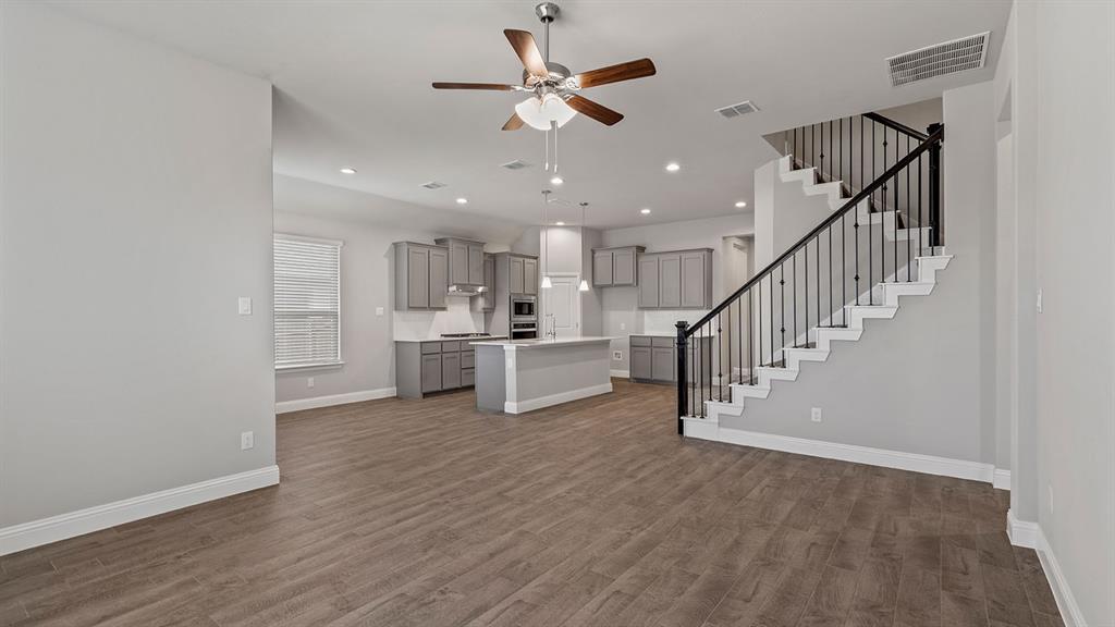 729 Soaring Hawk Drive Aledo, TX 76008 - Photo 9 of 38 a view of kitchen with furniture and a chandelier fan