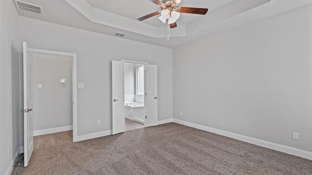 729 Soaring Hawk Drive Aledo, TX 76008 - Photo 12 of 38 an empty room with a empty space and a ceiling fan