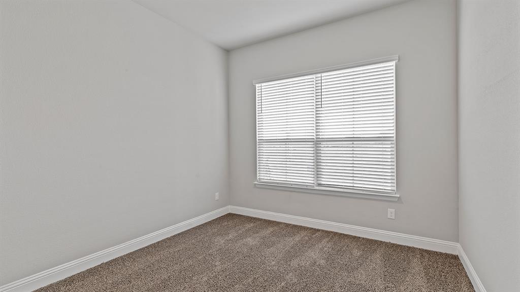 729 Soaring Hawk Drive Aledo, TX 76008 - Photo 17 of 38 an empty room with a window