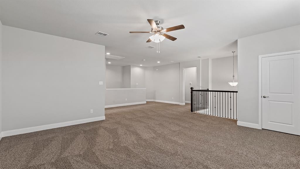 729 Soaring Hawk Drive Aledo, TX 76008 - Photo 22 of 38 a view of an empty room and kitchen view