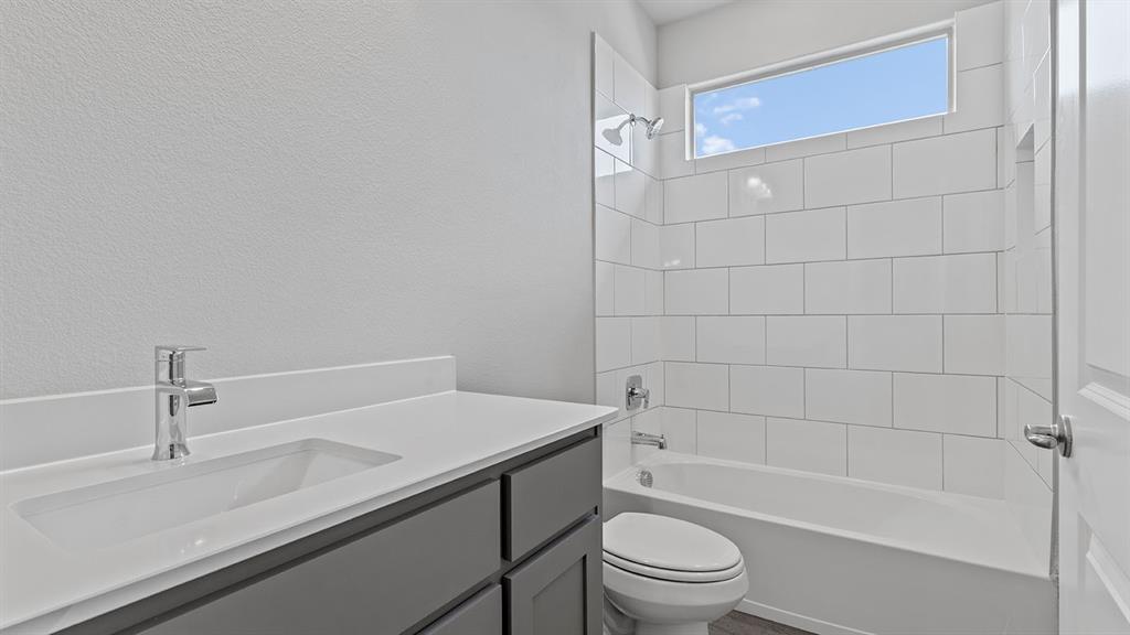 729 Soaring Hawk Drive Aledo, TX 76008 - Photo 25 of 38 a bathroom with a sink a toilet and shower