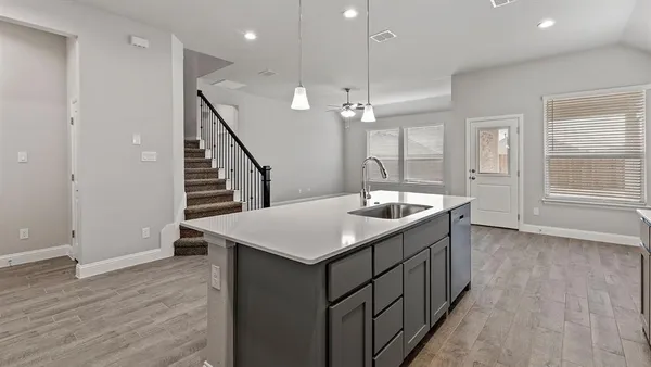 a kitchen with a stove and a sink