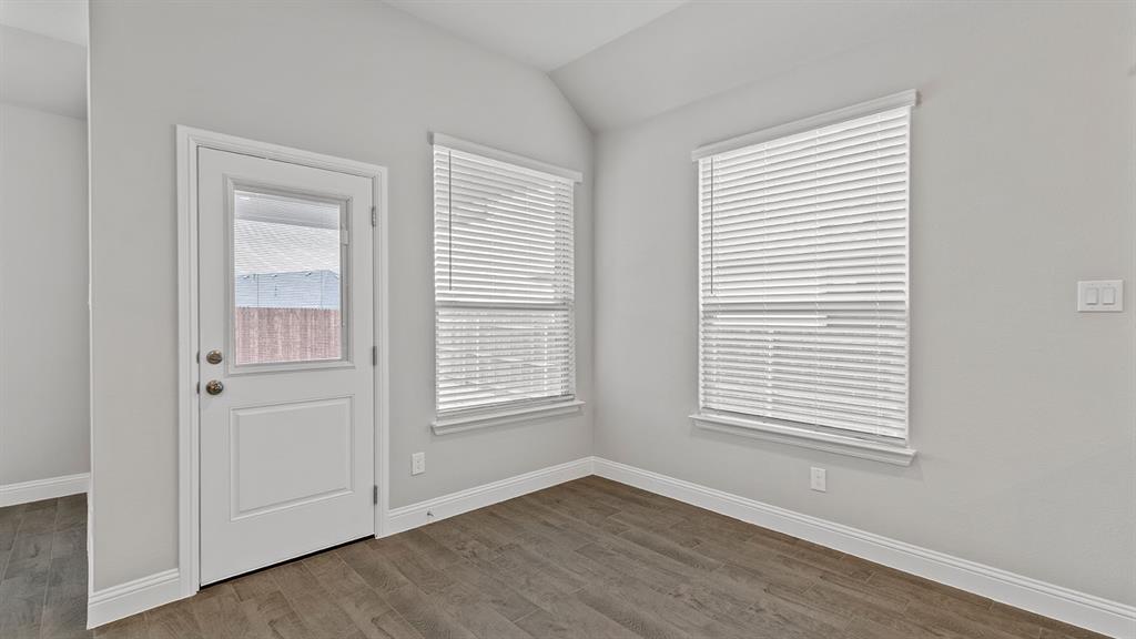 729 Soaring Hawk Drive Aledo, TX 76008 - Photo 5 of 38 an empty room with wooden floor and windows
