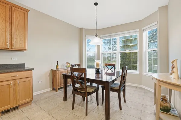 a dining room with furniture and window