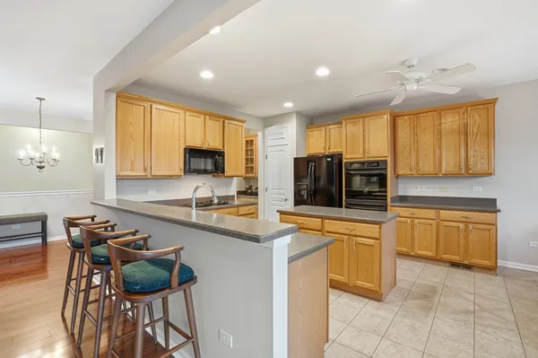 a kitchen with stainless steel appliances a stove sink and microwave