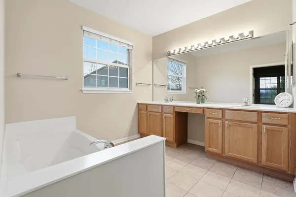 a bathroom with a sink a vanity and a mirror