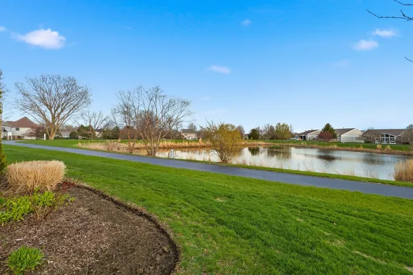 a view of a lake with a big yard