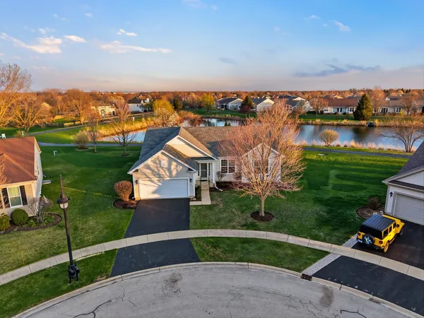 an aerial view of a residential houses with outdoor space and swimming pool