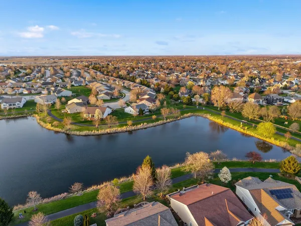 an aerial view of residential houses with outdoor space