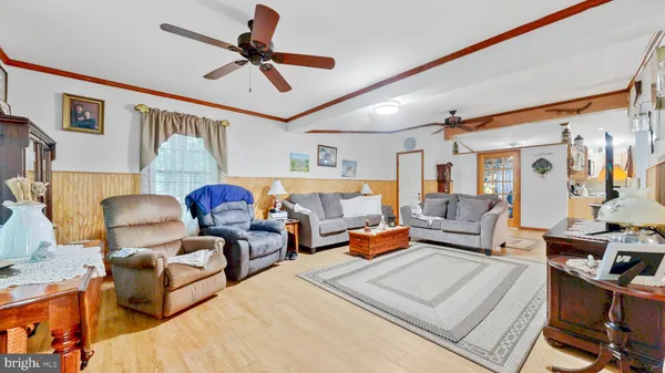 a bedroom with a bed window and a flat screen tv