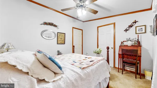 a bedroom with bed and a window