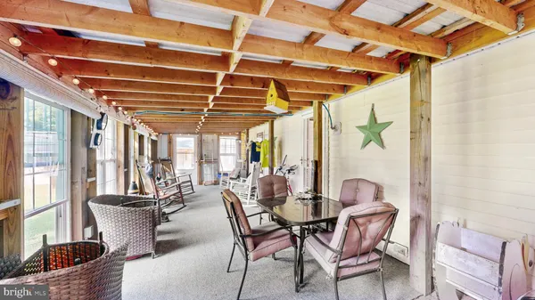 a living room with lots of furniture and a chandelier