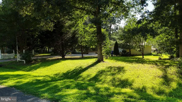a view of a swimming pool with a yard