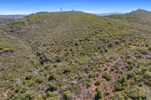 a view of a building with a mountain in the background