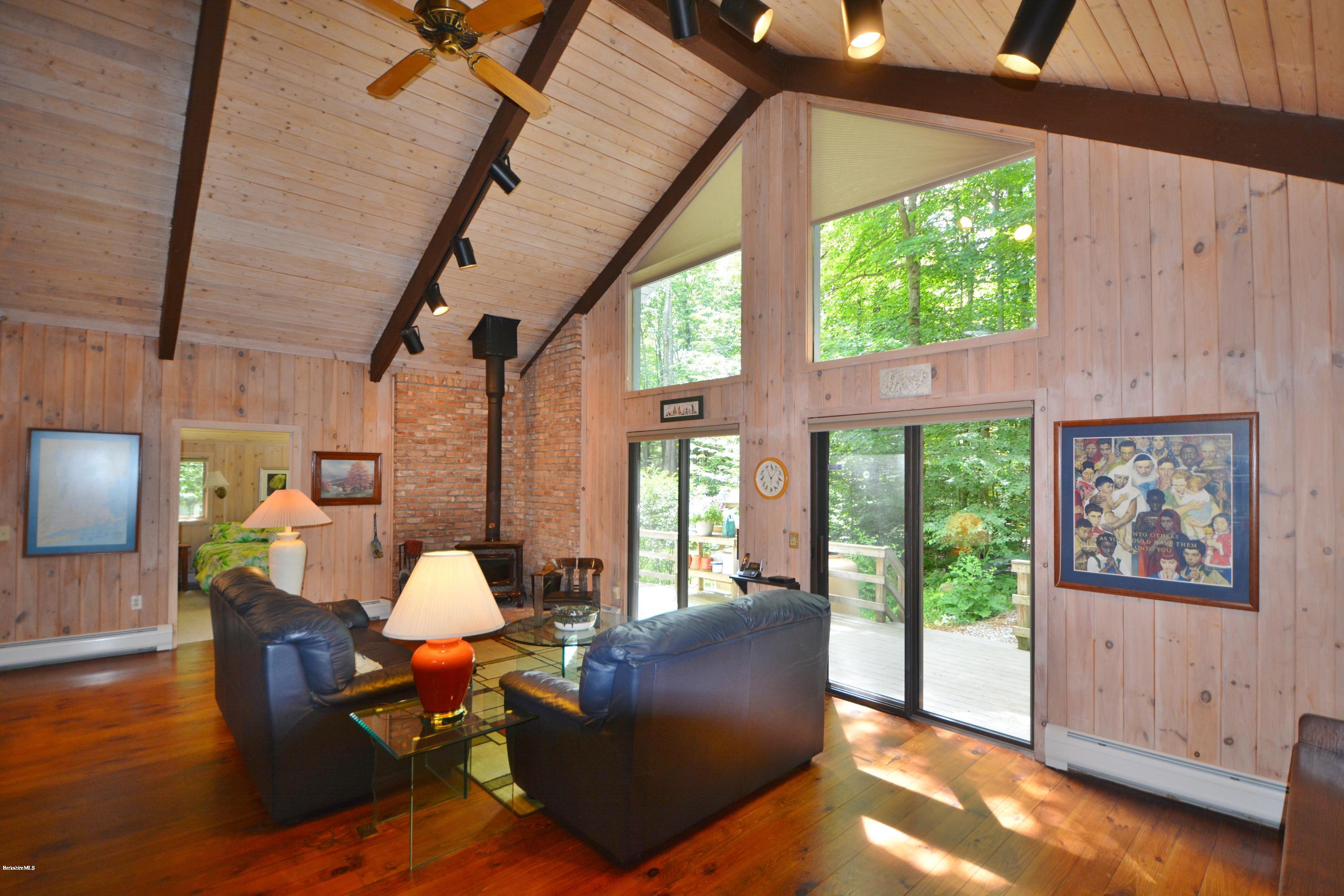 862 Moberg Road Becket, MA 01223 - Photo 3 of 26 a living room with furniture and a large window