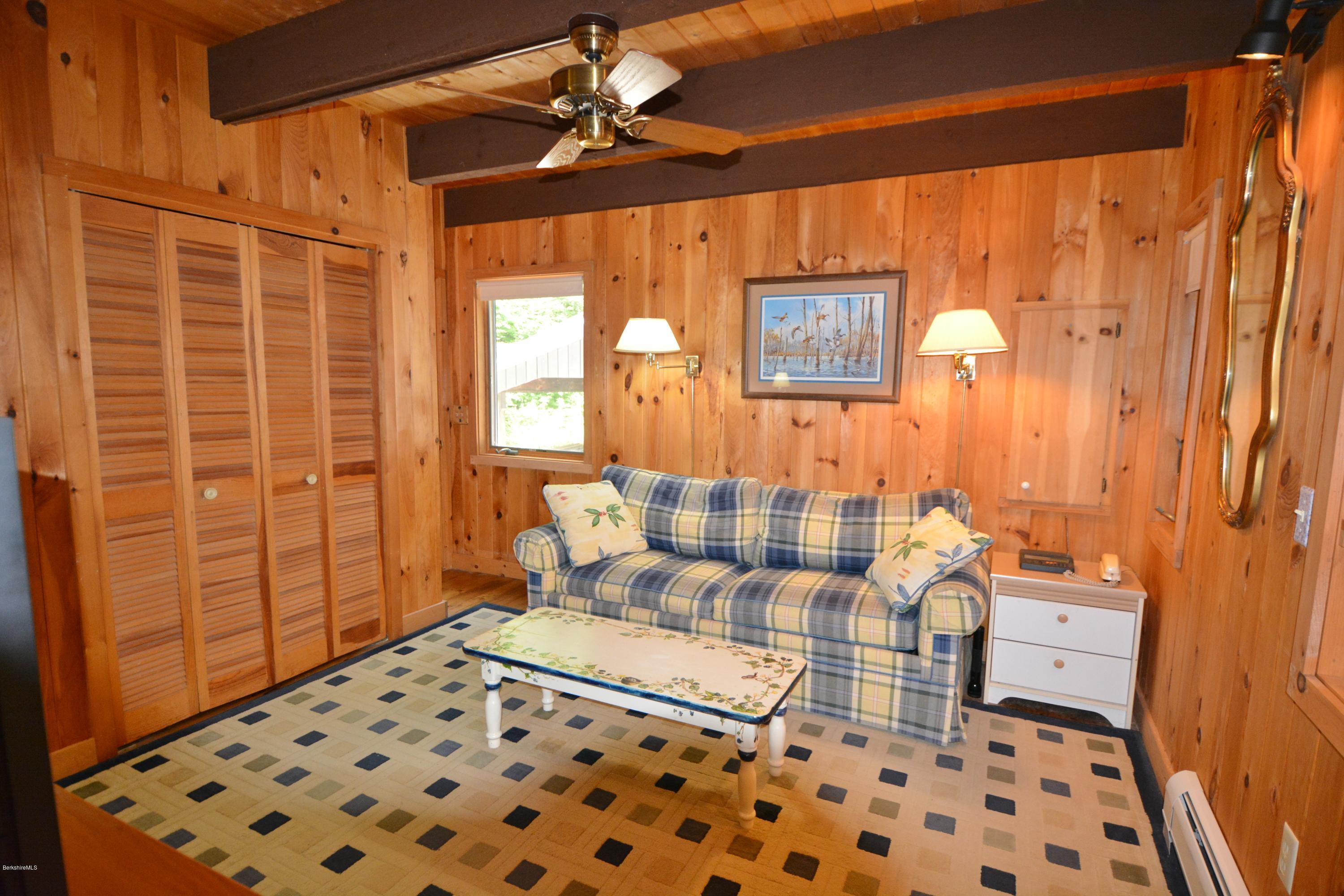 862 Moberg Road Becket, MA 01223 - Photo 8 of 26 a bedroom with a bed and a shower