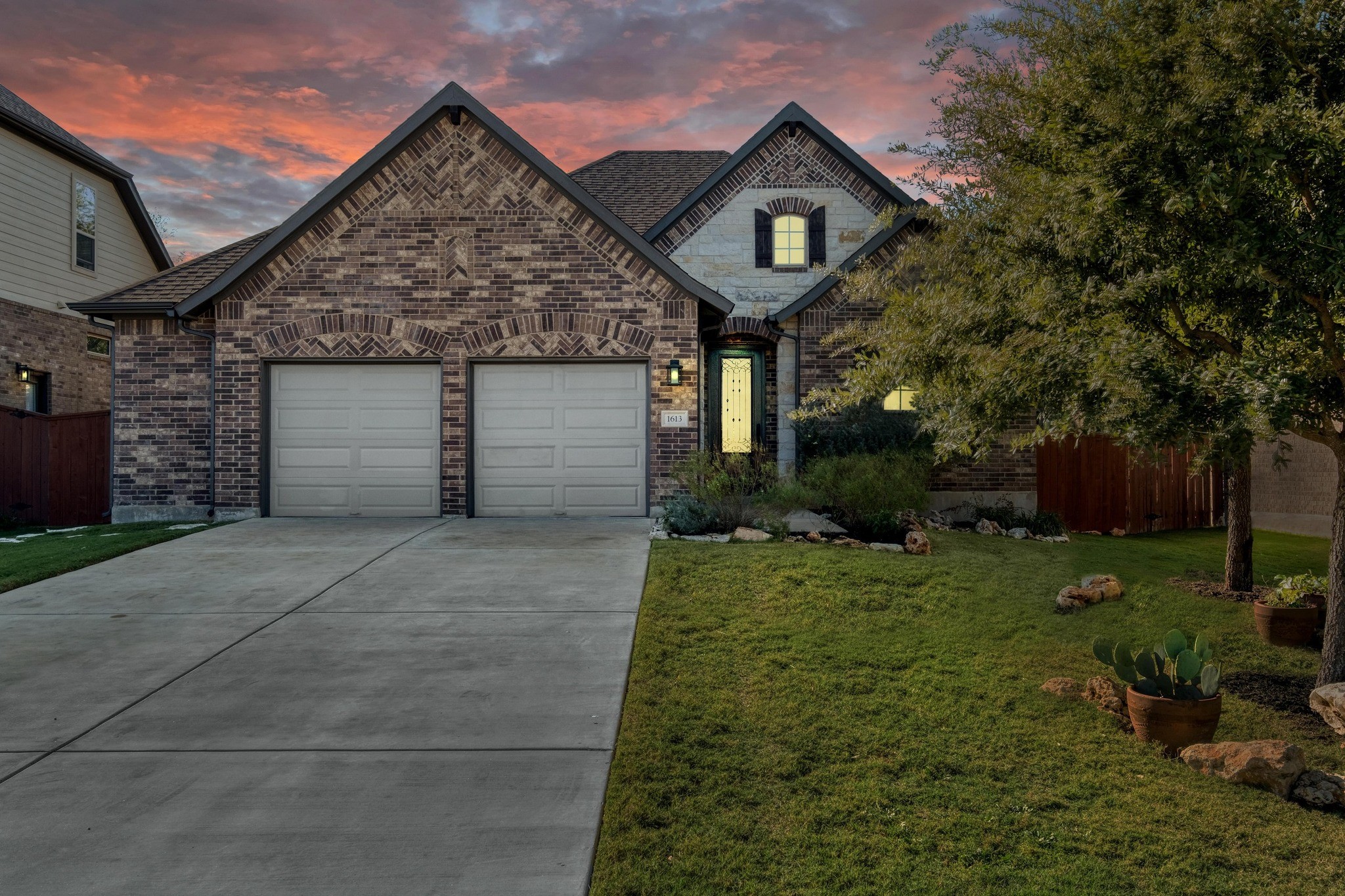 1613 Highland Ridge Road Georgetown, TX 78628 - Photo 1 of 1 a front view of a house with a yard and garage