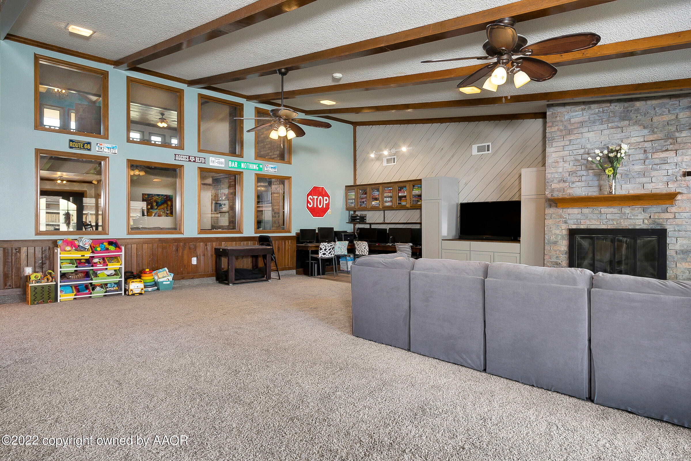 6600 Stoneham Drive Amarillo, TX 79109 - Photo 13 of 43 a living room with furniture and a fireplace