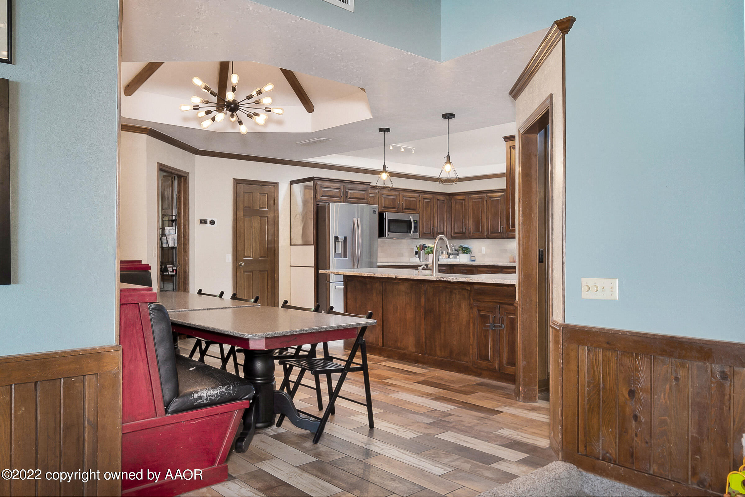 6600 Stoneham Drive Amarillo, TX 79109 - Photo 14 of 43 a view of a dining room with furniture window and wooden floor