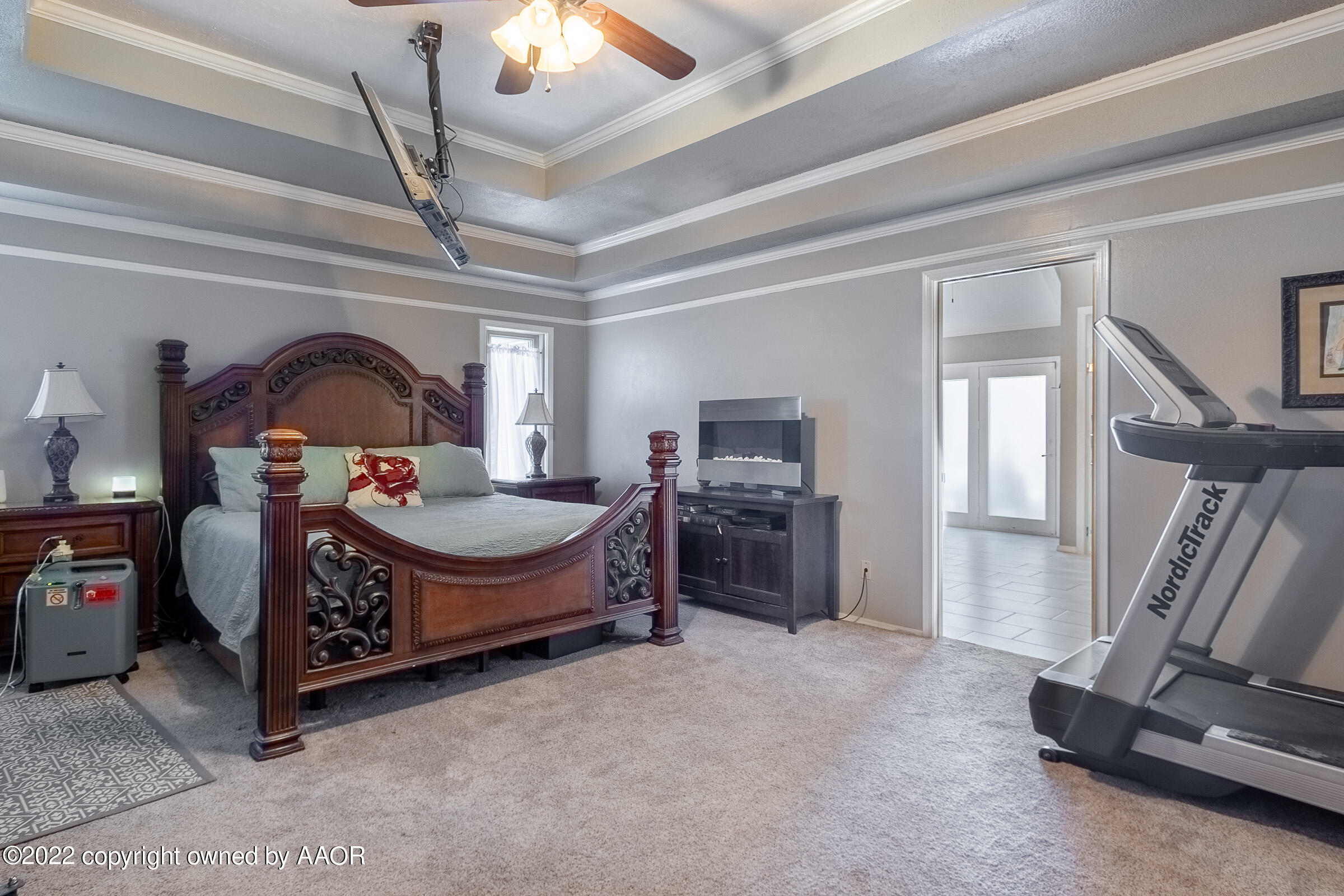 6600 Stoneham Drive Amarillo, TX 79109 - Photo 19 of 43 a living room with furniture a flat screen tv and a fireplace