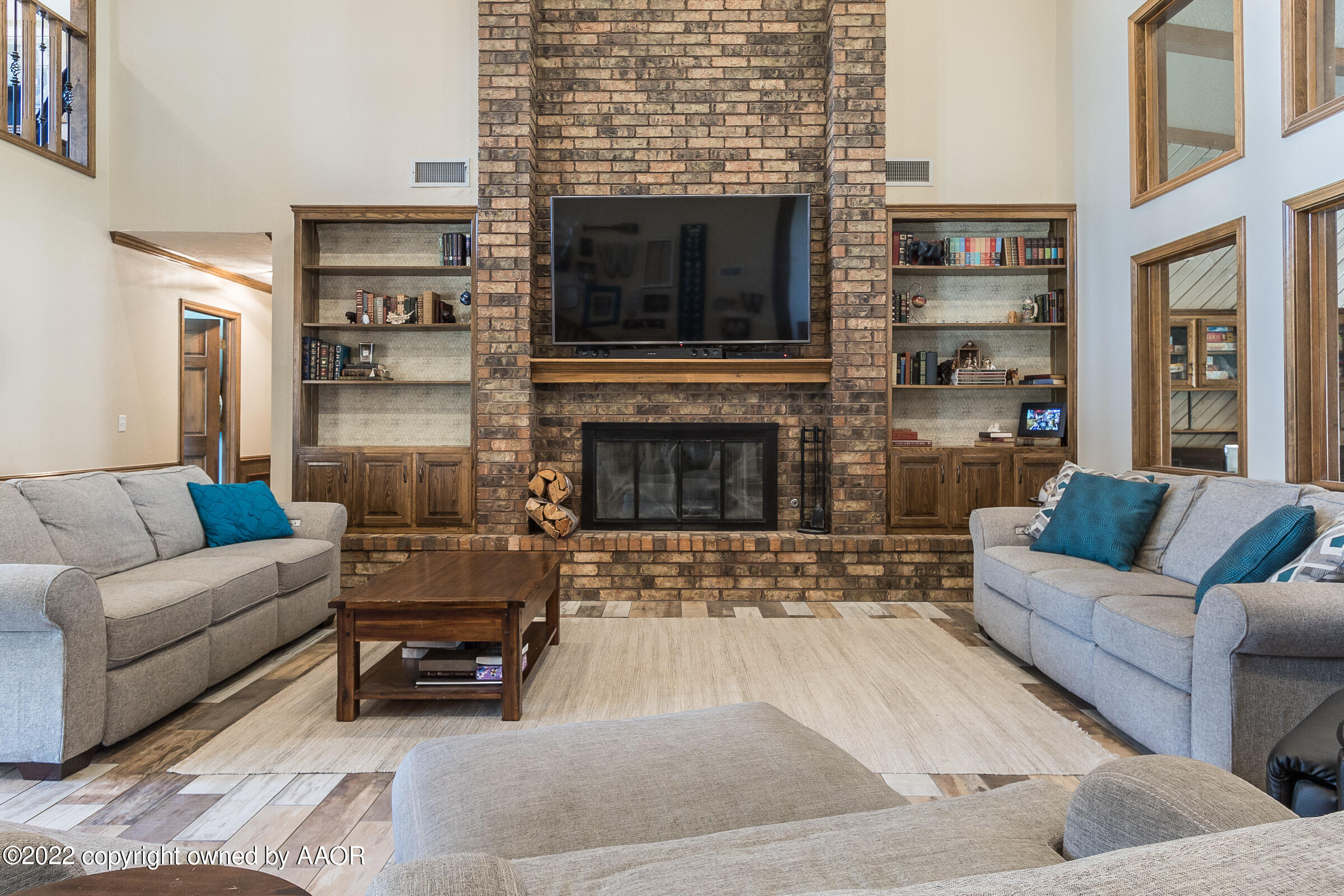 6600 Stoneham Drive Amarillo, TX 79109 - Photo 2 of 43 a living room with furniture and a fireplace