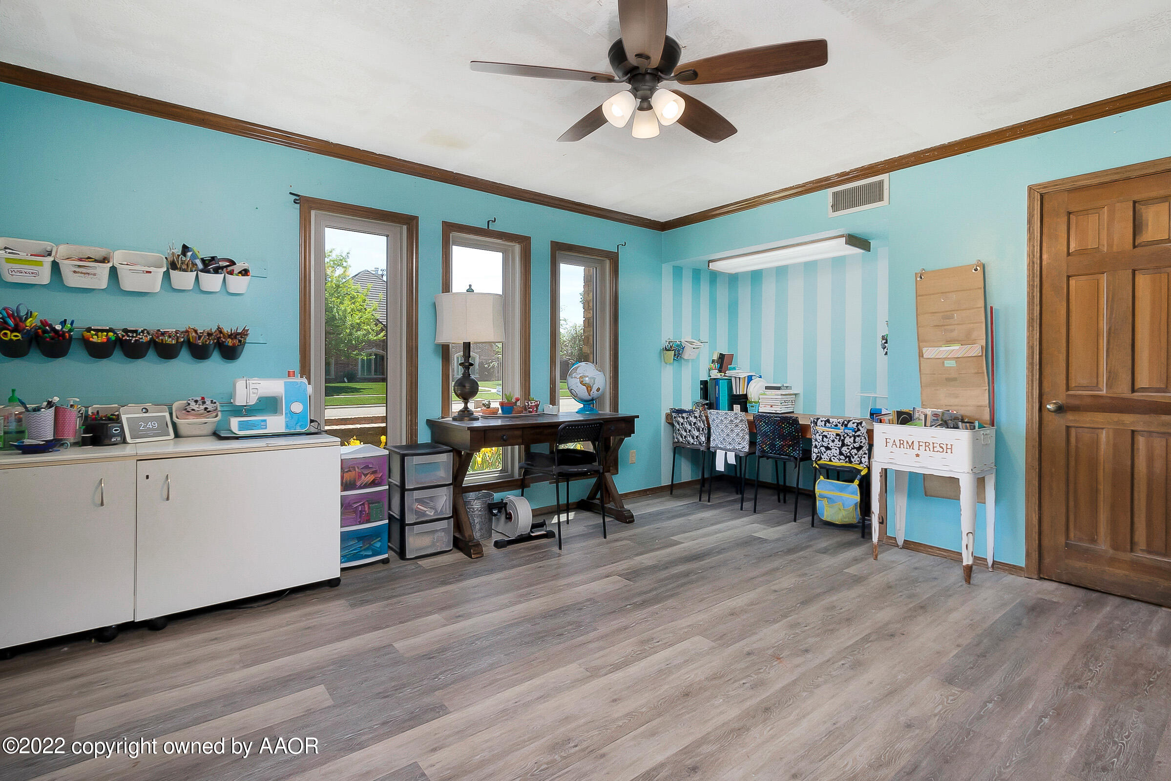 6600 Stoneham Drive Amarillo, TX 79109 - Photo 24 of 43 a living room with furniture and a wooden floor