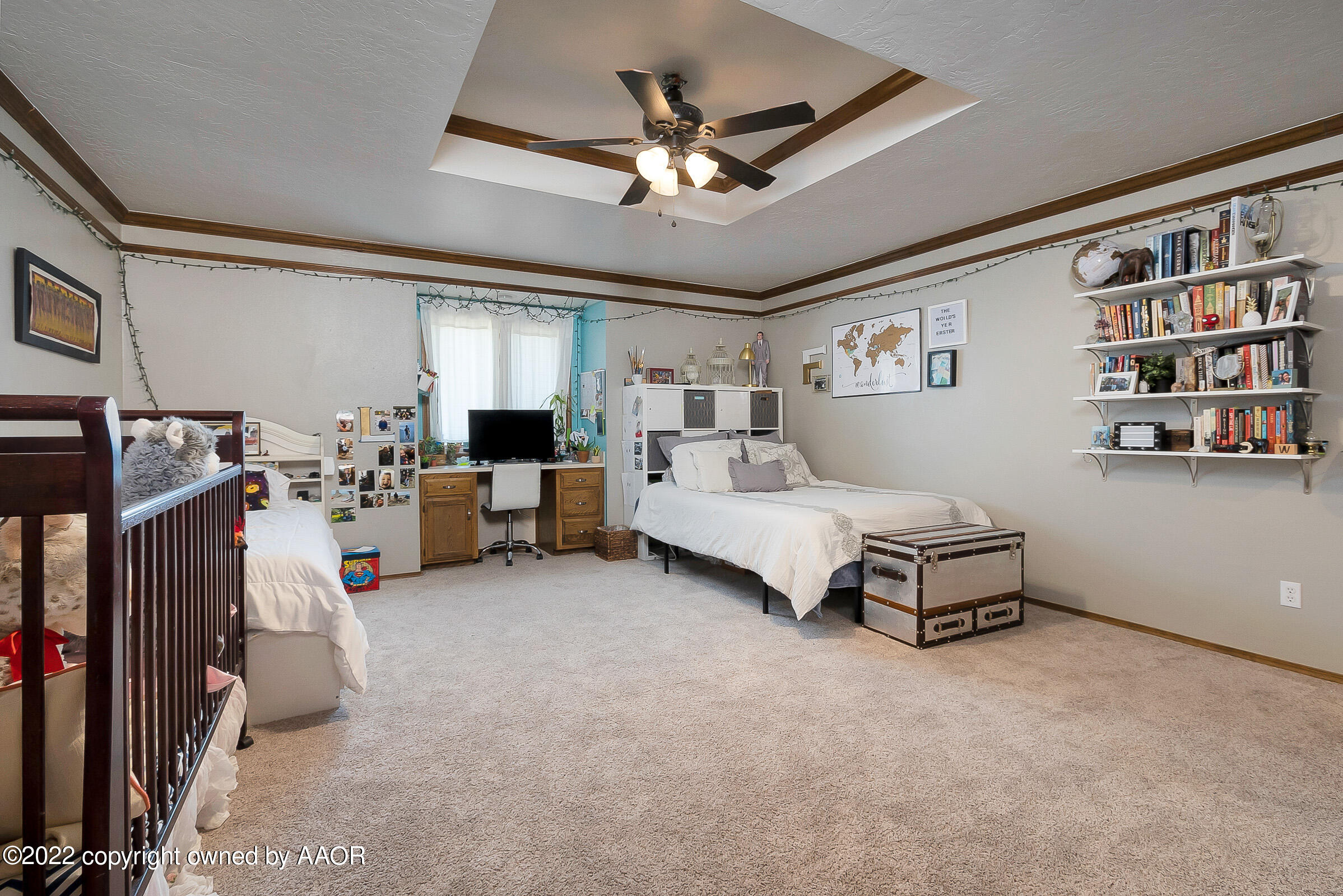 6600 Stoneham Drive Amarillo, TX 79109 - Photo 25 of 43 a living room with furniture and a flat screen tv